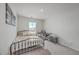 Cozy bedroom with a metal bed frame and a built-in workspace at 261 Firewheel Ct, Summerville, SC 29486