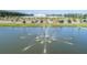 Aerial view of a pond with a fountain in a community at 261 Firewheel Ct, Summerville, SC 29486