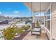 Relaxing front porch swing with view of a snow covered neighborhood at 261 Firewheel Ct, Summerville, SC 29486
