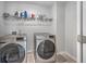 Laundry room with washer, dryer, and ample storage space at 261 Firewheel Ct, Summerville, SC 29486
