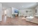 Open living room featuring L-shaped sectional and hardwood floors at 261 Firewheel Ct, Summerville, SC 29486