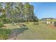 Community picnic area with tables, grills, and a pond view at 261 Firewheel Ct, Summerville, SC 29486