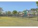 Modern playground with slides, climbing structures, and fenced area at 261 Firewheel Ct, Summerville, SC 29486