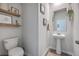 Small powder room with pedestal sink and wood floors at 261 Firewheel Ct, Summerville, SC 29486