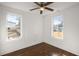 Bedroom featuring hardwood floors, ceiling fan, and two windows at 2889 Alabama Drive, North Charleston, SC 29405