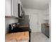 Modern kitchen featuring gray cabinetry, stainless steel appliances, butcher block countertops, and marble floors at 2889 Alabama Drive, North Charleston, SC 29405