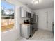 Modern kitchen featuring gray cabinetry, stainless steel appliances, and marble floors at 2889 Alabama Drive, North Charleston, SC 29405