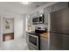Updated kitchen with gray cabinets, stainless steel appliances, and butcher block countertops at 2889 Alabama Drive, North Charleston, SC 29405