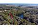 Aerial view showing home's location within a wooded neighborhood by the water at 2908 Old Drake Dr, Seabrook Island, SC 29455