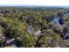 Aerial view of house nestled in wooded area near water, ocean visible in background at 2908 Old Drake Dr, Seabrook Island, SC 29455