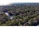 Aerial view of a house near the water, surrounded by trees at 2908 Old Drake Dr, Seabrook Island, SC 29455
