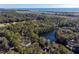 Aerial view of a house surrounded by lush greenery and water at 2908 Old Drake Dr, Seabrook Island, SC 29455