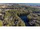 Aerial view of property showcasing a home nestled in a lush, wooded area near the water at 2908 Old Drake Dr, Seabrook Island, SC 29455