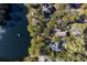 Aerial view showing home's location near a lake in a lush, wooded setting at 2908 Old Drake Dr, Seabrook Island, SC 29455