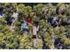 Aerial view showcasing the home's private setting among trees near water at 2908 Old Drake Dr, Seabrook Island, SC 29455