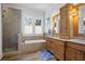 Bathroom with double vanity, soaking tub, and walk-in shower at 2908 Old Drake Dr, Seabrook Island, SC 29455