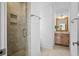 Small bathroom with shower and wood vanity at 2908 Old Drake Dr, Seabrook Island, SC 29455