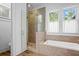 Bathroom featuring a walk-in shower and a soaking tub at 2908 Old Drake Dr, Seabrook Island, SC 29455