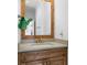 Small bathroom with wood vanity and mirror at 2908 Old Drake Dr, Seabrook Island, SC 29455