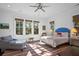 Bright bedroom with blue headboard, and large windows offering tranquil views at 2908 Old Drake Dr, Seabrook Island, SC 29455