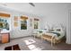 Bedroom with twin beds, workspace, and window views at 2908 Old Drake Dr, Seabrook Island, SC 29455