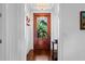 Bright entryway with hardwood floors, a wooden door, and a small table at 2908 Old Drake Dr, Seabrook Island, SC 29455