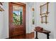 Bright entryway with hardwood floors, a wooden door, and a small table at 2908 Old Drake Dr, Seabrook Island, SC 29455