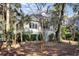 Two-story home with screened porch and lush landscaping at 2908 Old Drake Dr, Seabrook Island, SC 29455