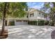 Two-car garage with light gray doors and a large driveway at 2908 Old Drake Dr, Seabrook Island, SC 29455