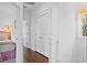 Bright hallway with hardwood floors and access to bedrooms at 2908 Old Drake Dr, Seabrook Island, SC 29455