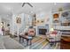 Living area with fireplace and built-in shelving, open to kitchen at 2908 Old Drake Dr, Seabrook Island, SC 29455