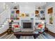 Spacious living room with built-in shelving and fireplace at 2908 Old Drake Dr, Seabrook Island, SC 29455