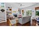 Open living room with built-in shelving and fireplace, plus stairs at 2908 Old Drake Dr, Seabrook Island, SC 29455