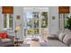 Living room with view of screened porch and tranquil water at 2908 Old Drake Dr, Seabrook Island, SC 29455
