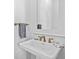 Small powder room with pedestal sink and framed mirror at 2908 Old Drake Dr, Seabrook Island, SC 29455