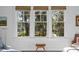 Bedroom with window showcasing scenic wooded and water views at 2908 Old Drake Dr, Seabrook Island, SC 29455