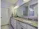 Bathroom with granite countertop double vanity and large mirror at 304 Bloomington Way, Summerville, SC 29486