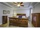 Primary bedroom with hardwood floors and large sleigh bed at 304 Bloomington Way, Summerville, SC 29486