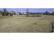 Community backyard with pond and homes with screened porches at 304 Bloomington Way, Summerville, SC 29486