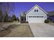 Gray siding house with two-car garage and manicured lawn at 304 Bloomington Way, Summerville, SC 29486