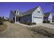 Gray siding house with two-car garage and manicured lawn at 304 Bloomington Way, Summerville, SC 29486