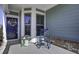 Inviting front porch with rocking chair and potted plants at 304 Bloomington Way, Summerville, SC 29486