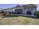 Back exterior view showing patio, screened porch and fenced backyard at 304 Bloomington Way, Summerville, SC 29486