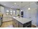 Spacious kitchen island with white cabinets and quartz countertop at 304 Bloomington Way, Summerville, SC 29486