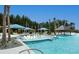 Spacious pool deck with lounge chairs and umbrellas at 304 Bloomington Way, Summerville, SC 29486