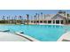 Large resort-style pool with palm trees and a clubhouse in the background at 304 Bloomington Way, Summerville, SC 29486