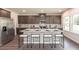 Modern kitchen with granite countertops, dark brown cabinets, and an island at 322 Calm Water Way, Summerville, SC 29486