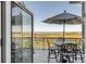 Outdoor balcony with an umbrella and seating area, perfect for enjoying the scenic view at 355 Cooper River Dr, Mount Pleasant, SC 29464