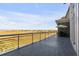 Spacious outdoor balcony with seating, providing panoramic views of the surrounding marshlands at 355 Cooper River Dr, Mount Pleasant, SC 29464