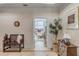 Charming hallway with stylish bench, decorative tree, and doorway with an ocean view at 355 Cooper River Dr, Mount Pleasant, SC 29464